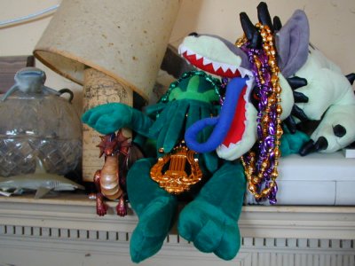 Plush Cthulhu and Hound of Tindalos in Mardi Gras beads